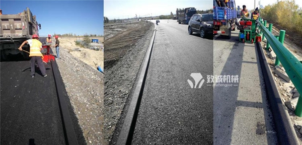 瀝青砂攔水帶滑模機施工現(xiàn)場